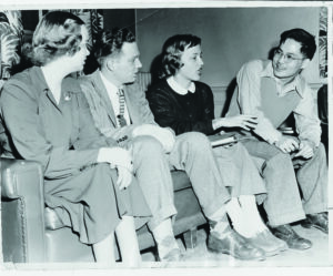 A group of students sits and chats in this black and white photo. Ochi (far right) served as secretary-treasurer of the Macalester Christian Association in 1947.