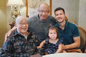 From left: Shigeru Ochi ’49, son Jim Ochi ’80, great-granddaughter Naomi Ochi and grandson Derek Ochi ’12 on Ochi’s 101st birthday.