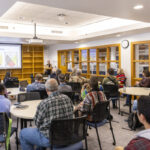 Artist Natchez Beaulieu presents her work to a room full of people in DeWitt Wallace Library