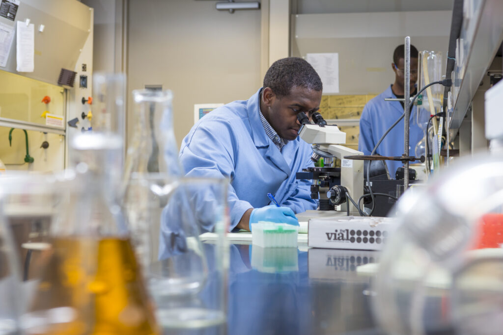 Mays working in the lab as a student.