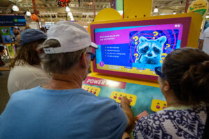 Fair-goers explore Mac’s CollectED project.