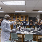 Dr. Malik Mays ’19 works with Macalester students in the lab.