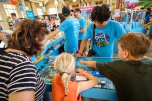 Fair-goers explore Mac’s CollectED project.