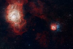 A colorful galaxy nebula in the night sky, surrounded by stars.