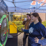 Student plays a carnival game