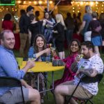 Four alumni sitting at a table