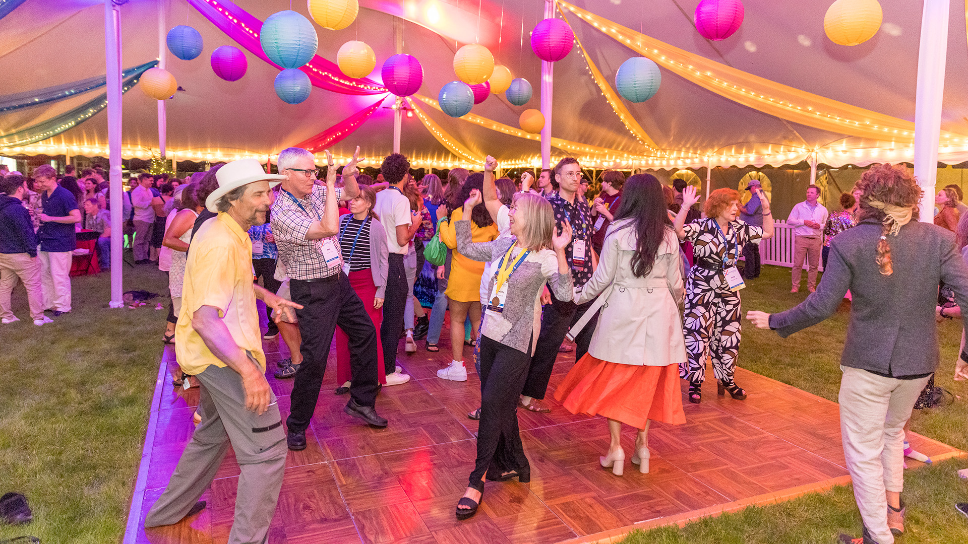 Alumni dancing under a disco ball at Macalester Reunion