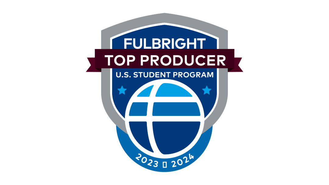 Blue graphic shield and globe logo that says "Fulbright Top Producer U.S. Student Program 2023-2024"