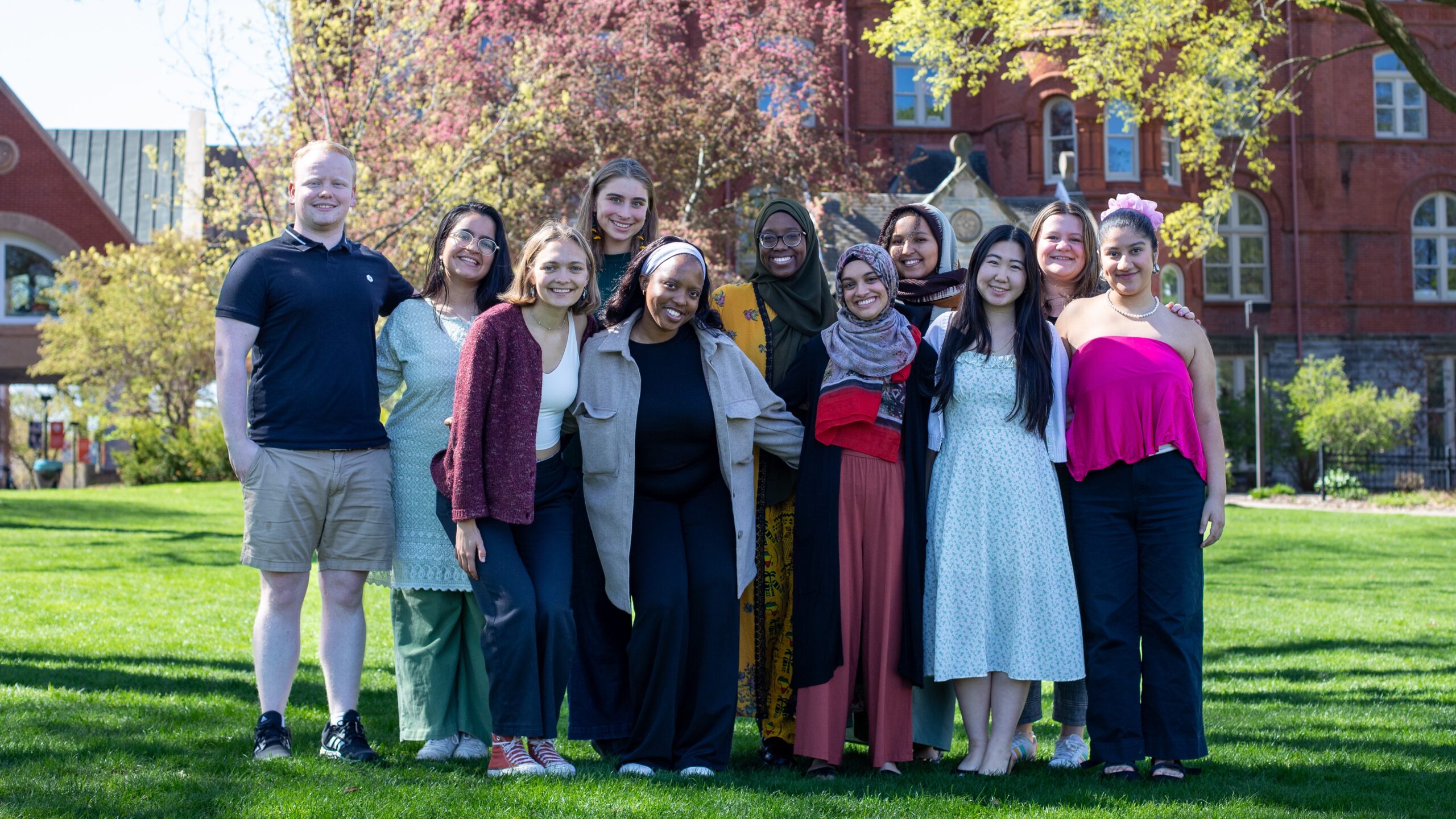 Distinguished Leadership Award for Outstanding Seniors recipients posing outside on the Macalester campus