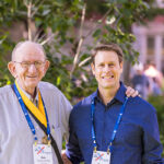 Two Reunion attendees, including one wearing a Golden Scots medal, pose for a picture