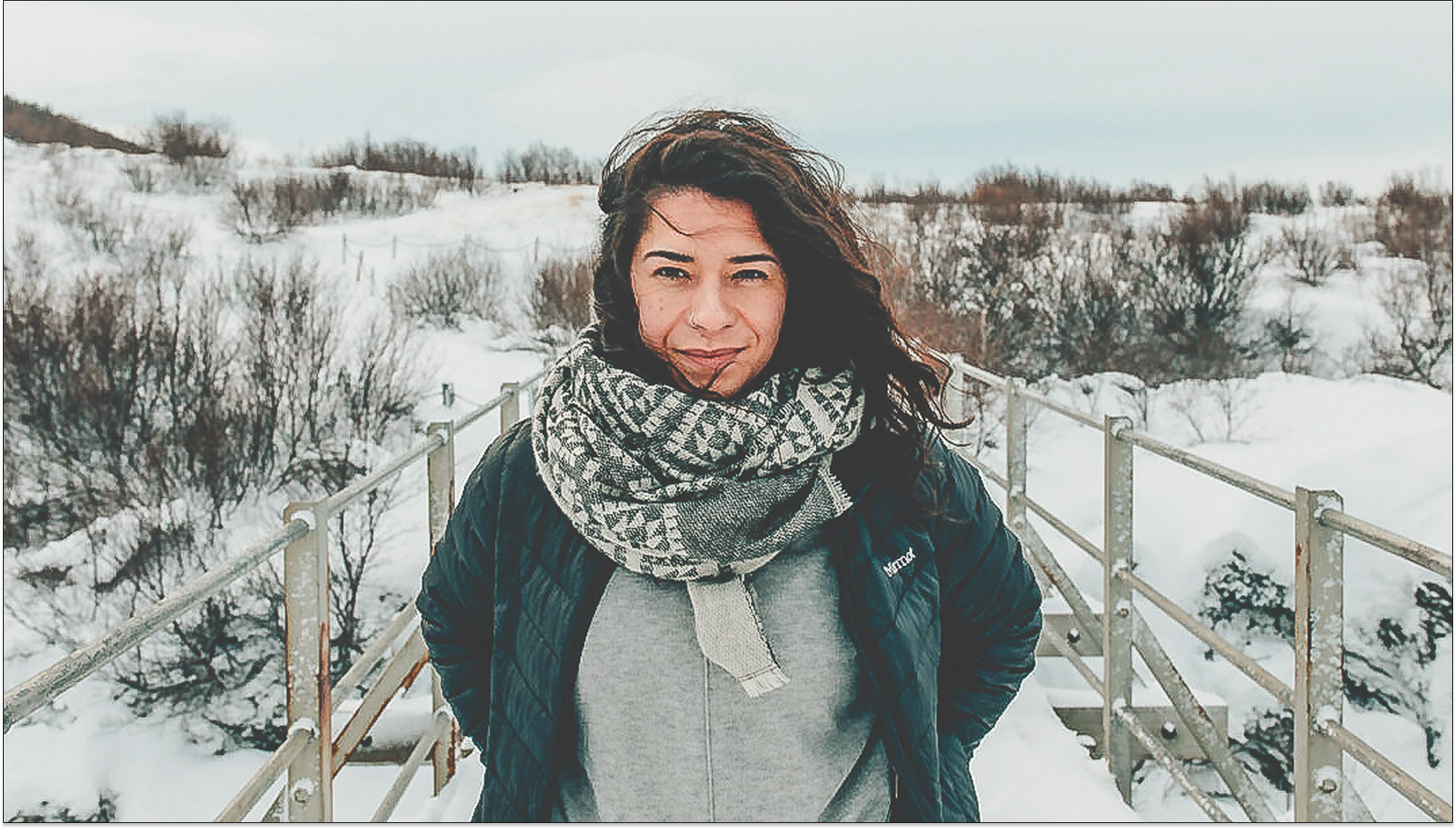 Medium shot of Professor Alix Johnson standing in a snowy landscape