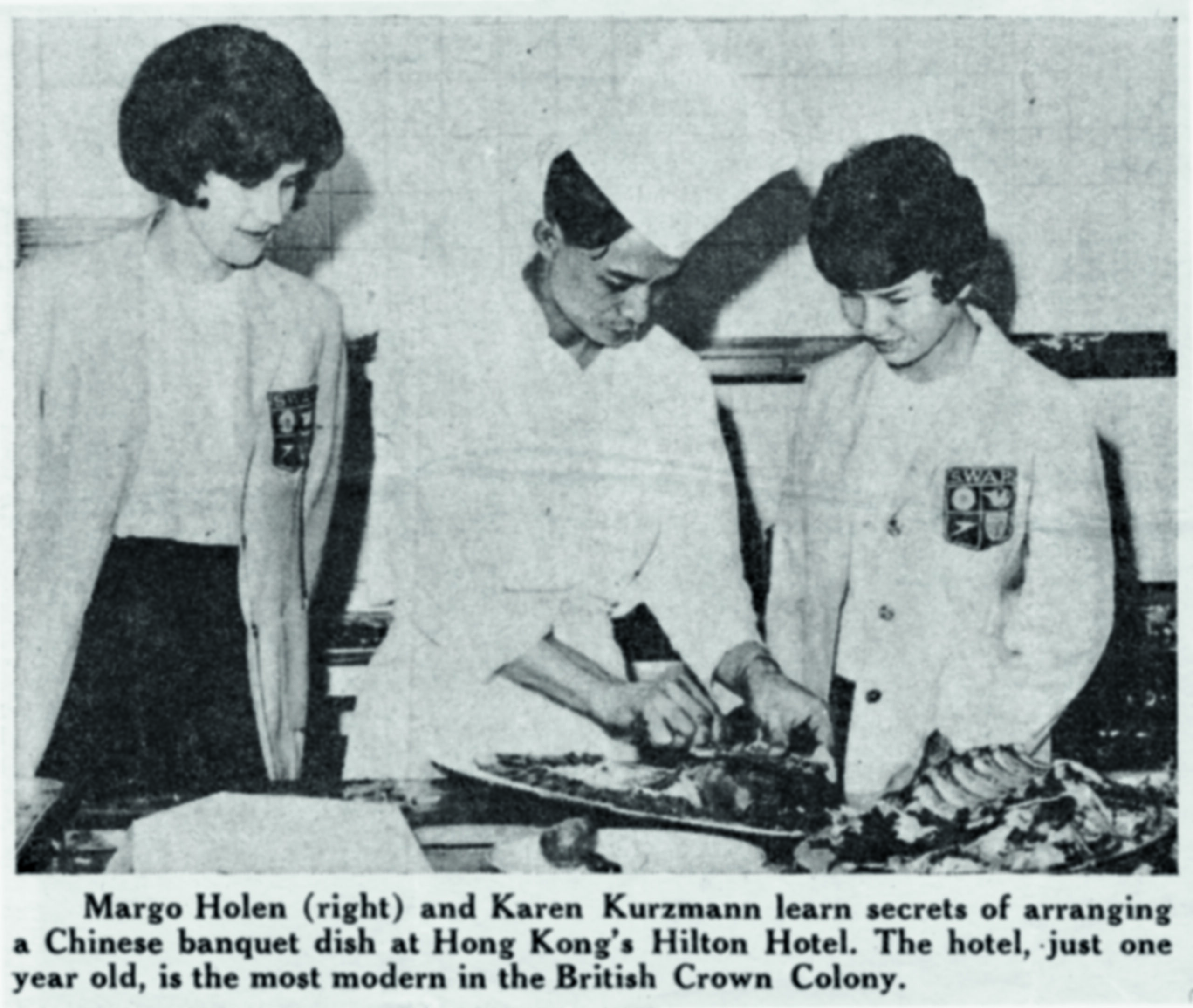 Chef demonstrating how to prepare a Chinese banquet dish to two women at the Hilton Hotel in Hong Kong.
