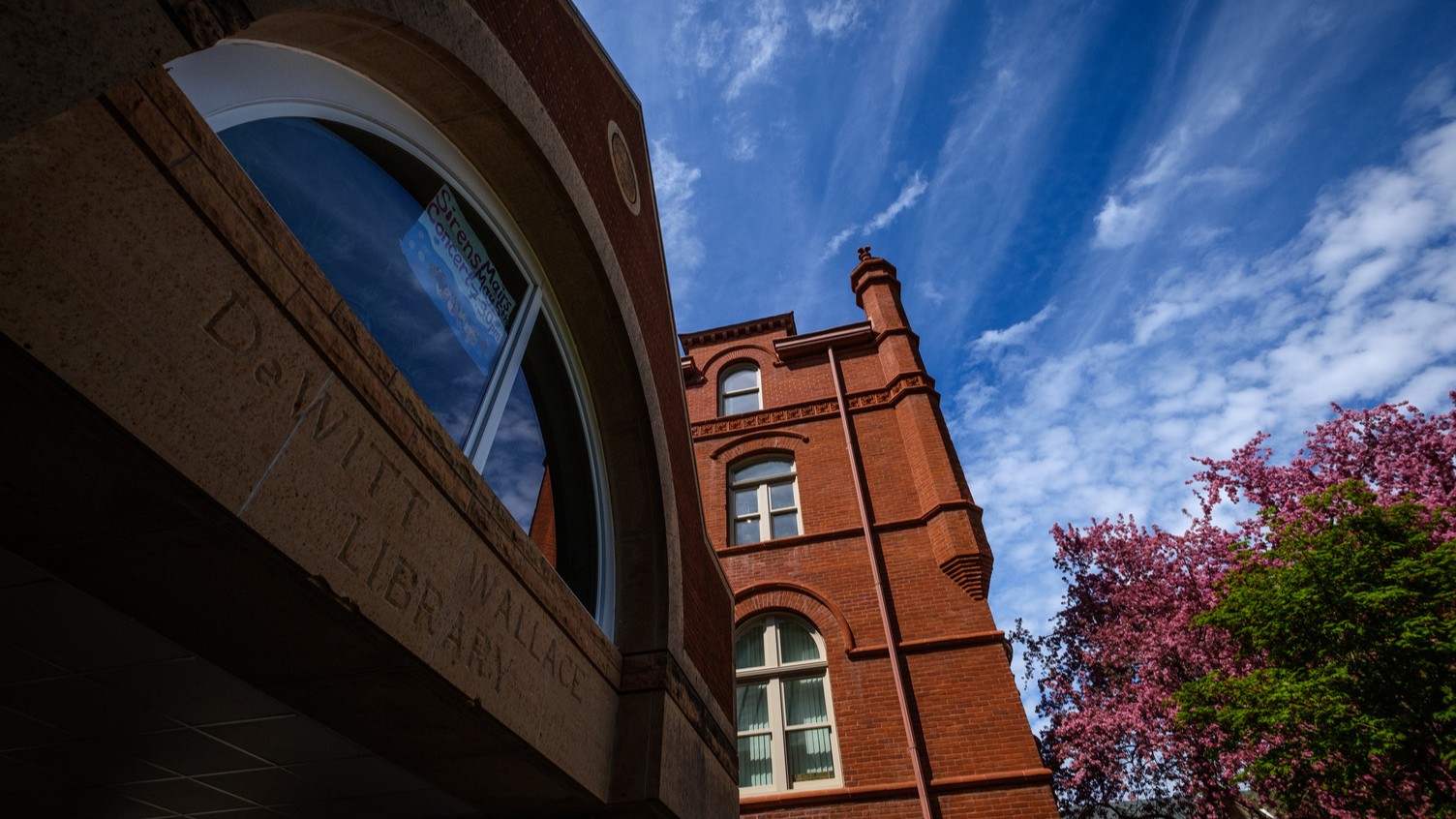 A low angle shot of DeWitt Wallace Library and Old Main in the summer sun.