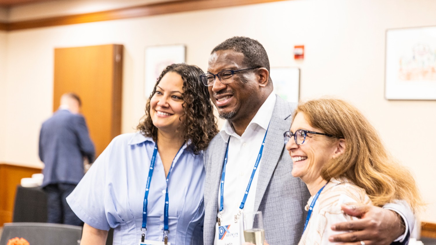 Abby Dos Santos ’01, Justin Brandon ’00, and Kim Cole ’96 pose for a candid photo at the Reunion 2026 Grand Welcome.
