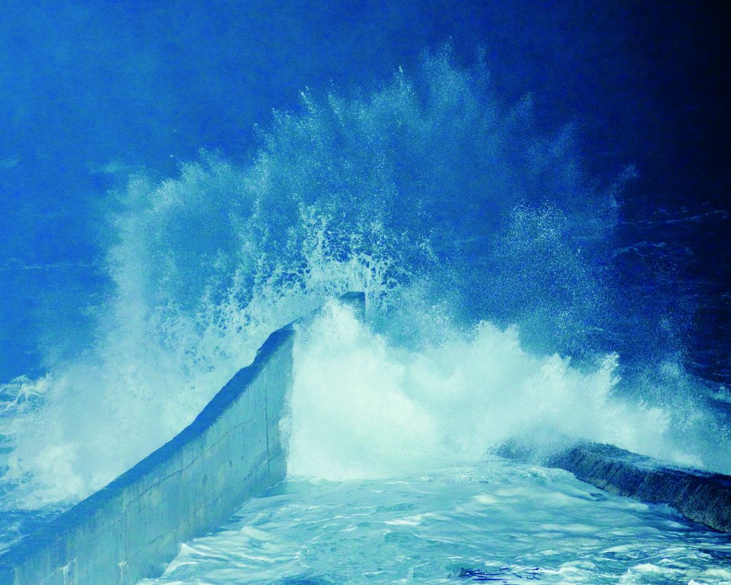 A wave crashes against the seawall at Depoe Bay, Oregon