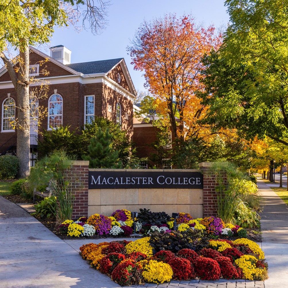 Fall colors bloom around the Macalester sign on Grand Avenue.