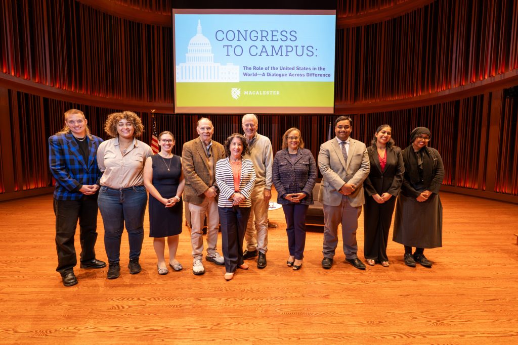 President Suzanne M. Rivera poses with former US Representatives Scott Klug and William Enyart, as well as Professor Duchess Harris, Professor Leah Witus, Beau Larsen, Tani Gangal ʼ29, Rohini Chatwani ʼ29, Sihaam Barre ʼ28, and Skye Raymond ’28.