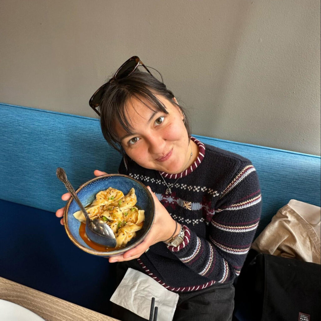 Mayumi Morgan poses with a bowl of food.