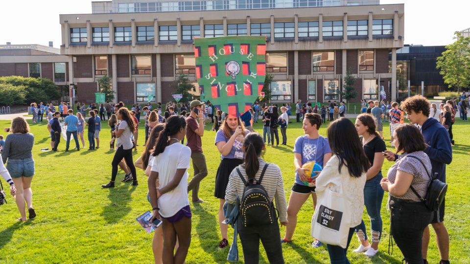 Students gathering on Shaw Field for Orientation