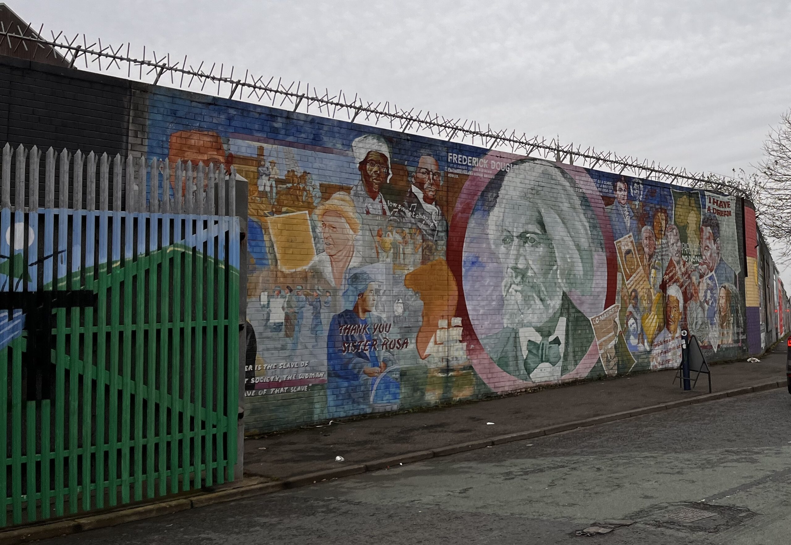 Colorful mural of Frederick Douglass and other American Civil Rights leaders on a wall in Northern Ireland