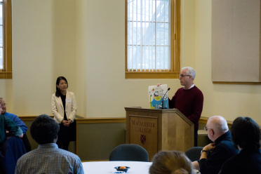 President Rosenberg presenting a poster