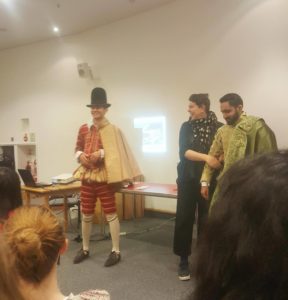 Class members trying on old Globe costumes