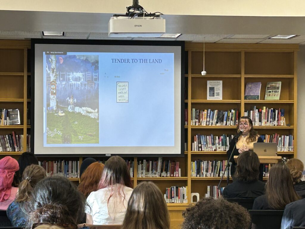 Eva presents at the front of the Harmon Room