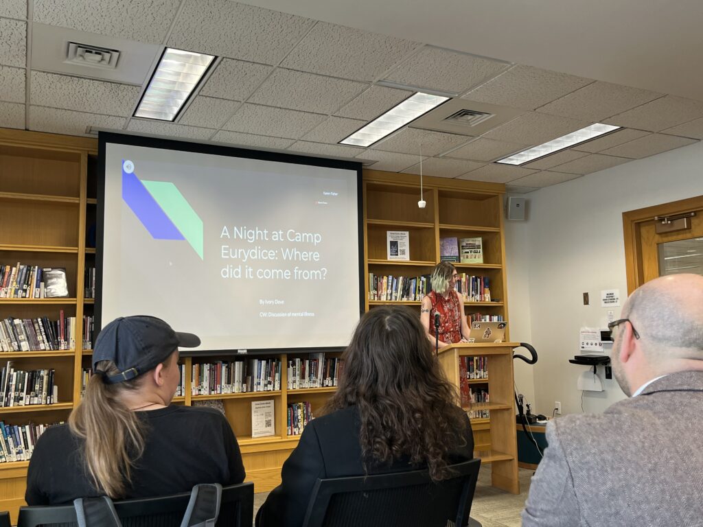 Ivory presenting at the front of the Harmon Room