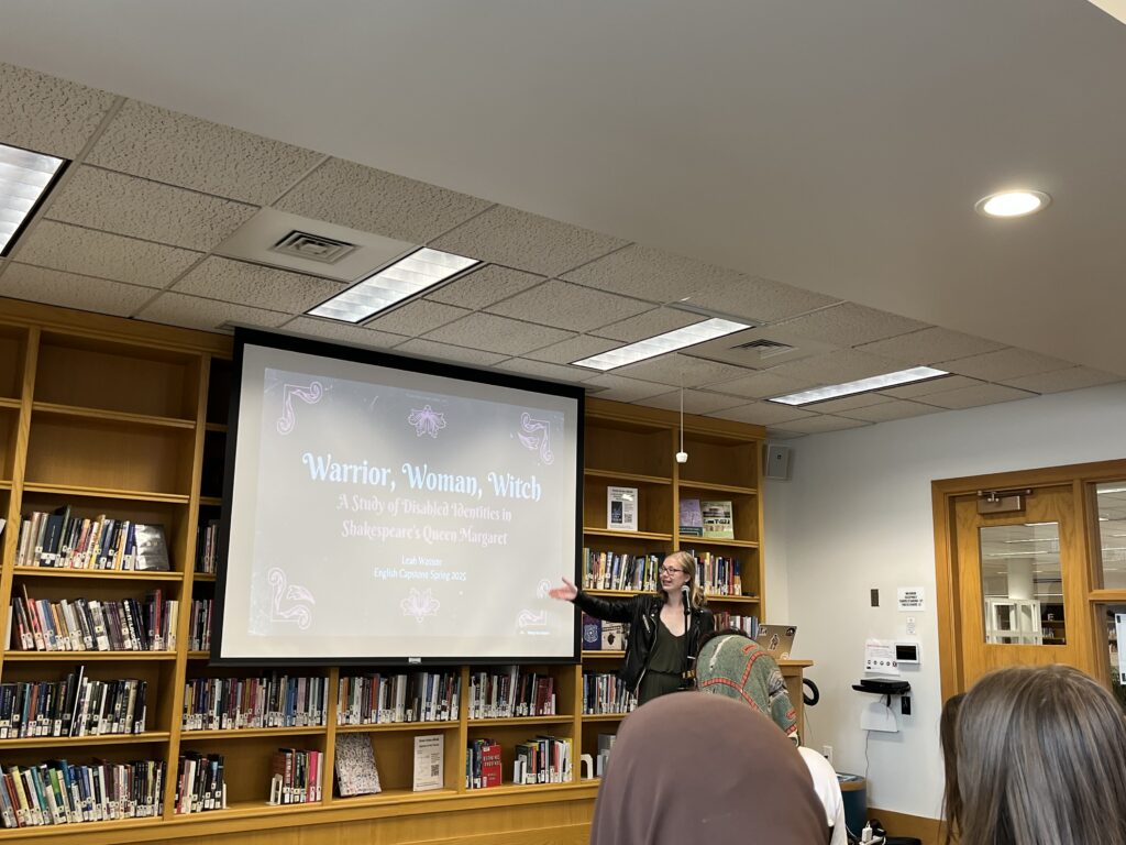 Leah presents at the front of the Harmon Room