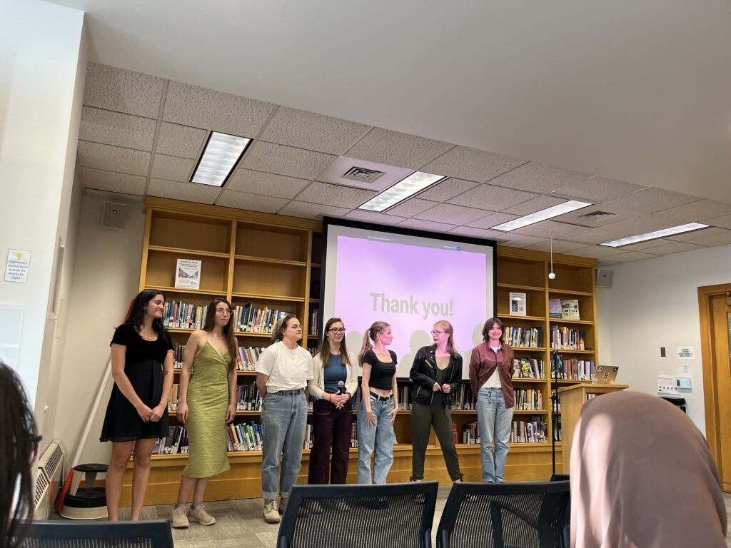 Capstone Night #2 presenters and their Honors Project counterparts stand at the front of the Harmon Room to answer questions