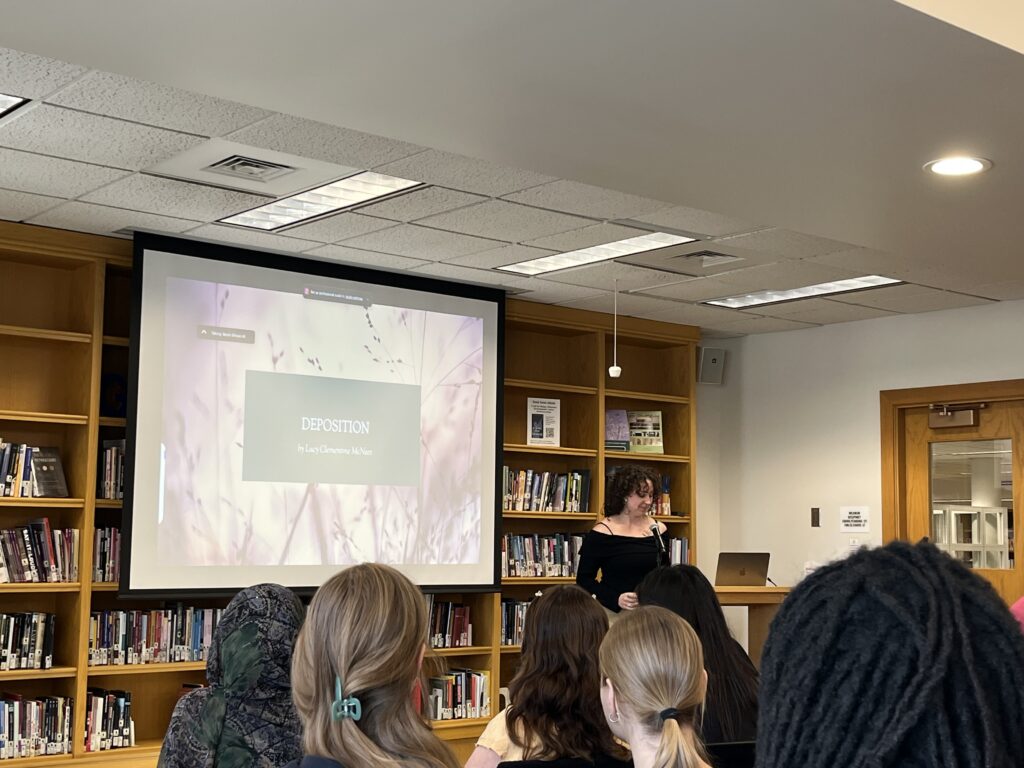 Lucy presents at the front of the Harmon Room