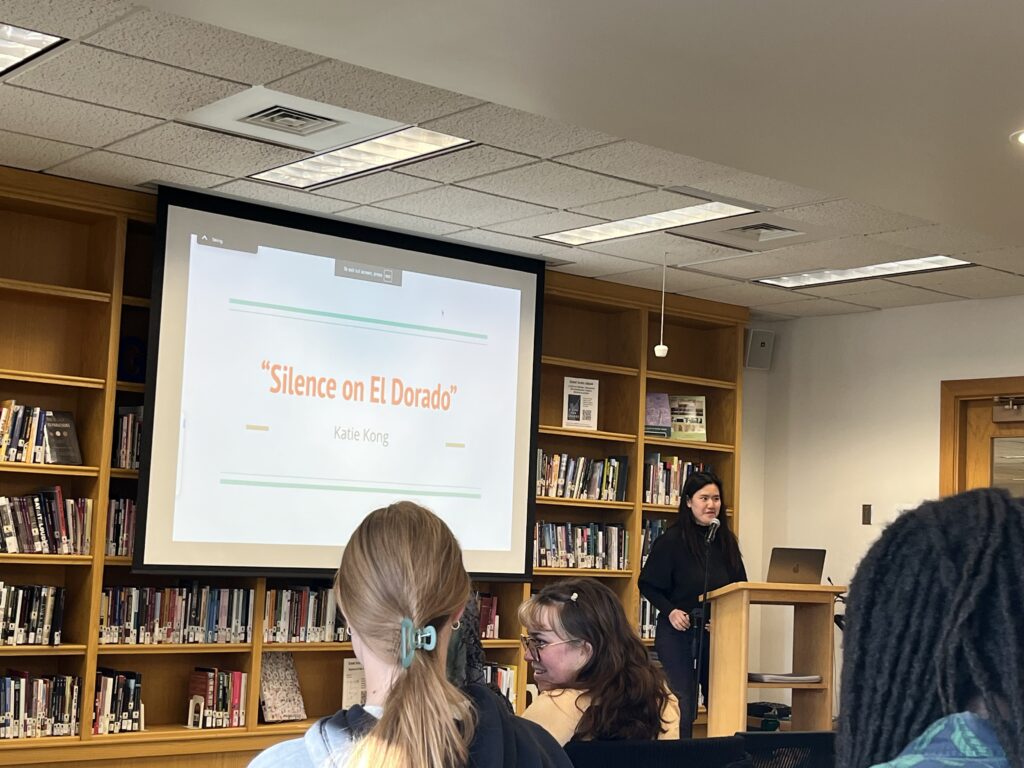 Katie presents at the front of the Harmon Room