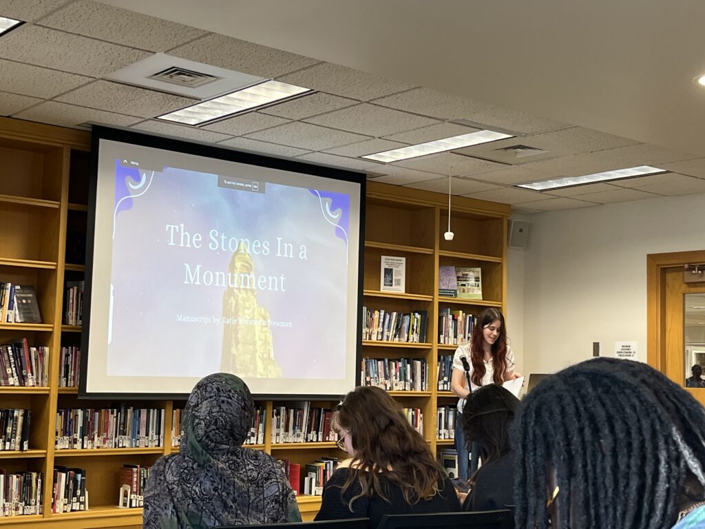 Katie presents at the front of the Harmon Room