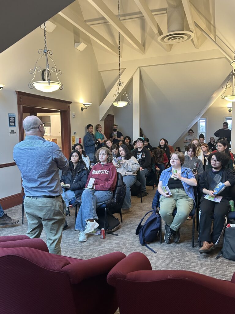 Prof. Woodward addressing the crowd at the anthology release party in Old Main 4