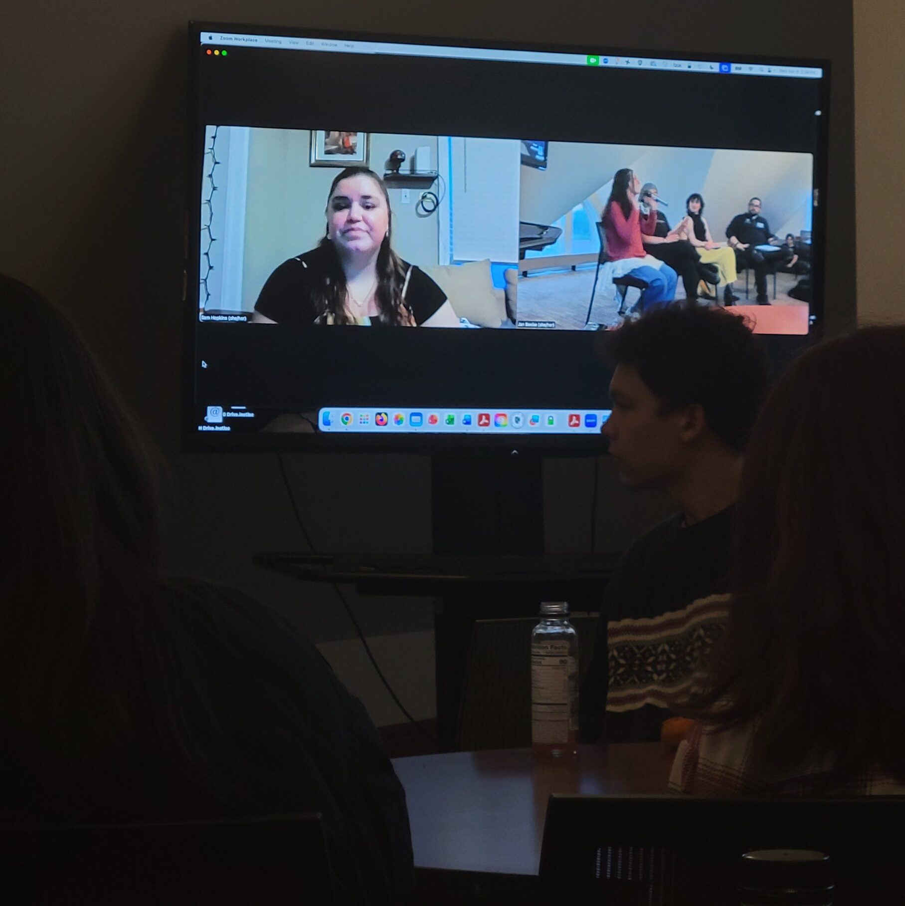 TV screen projecting Zoom with  Sam Hopkins.