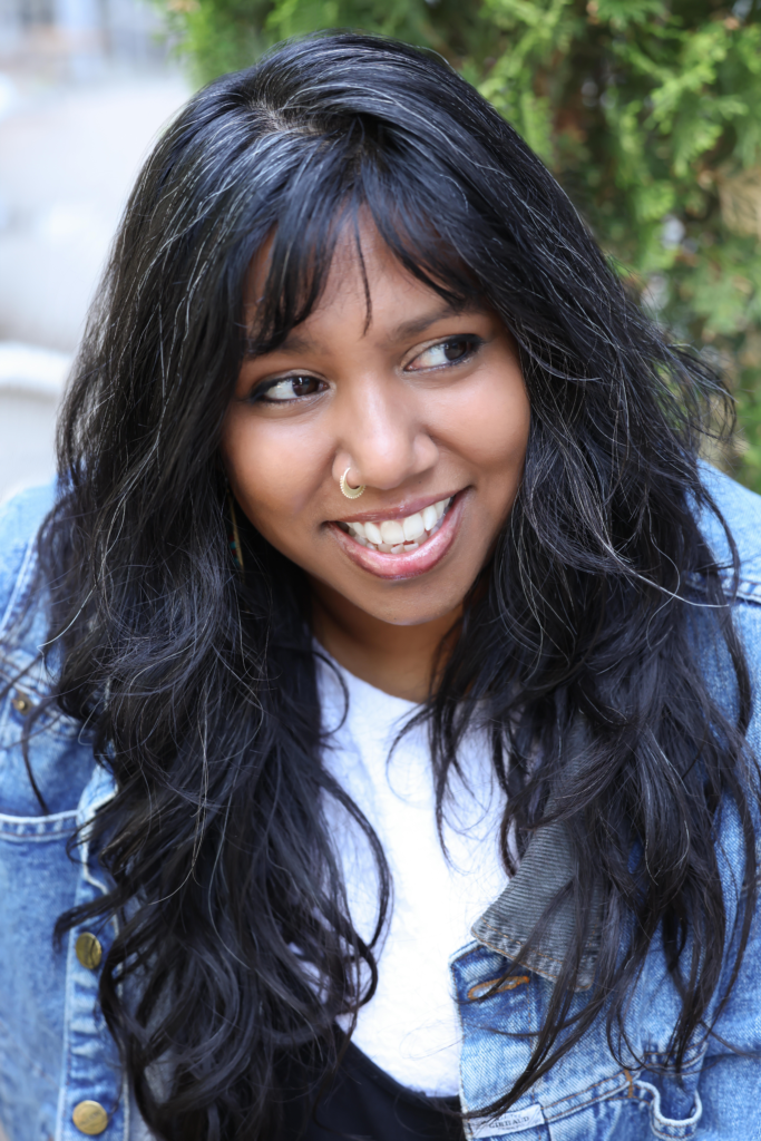 A headshot of Prof. Masum-Javed smiling outside.