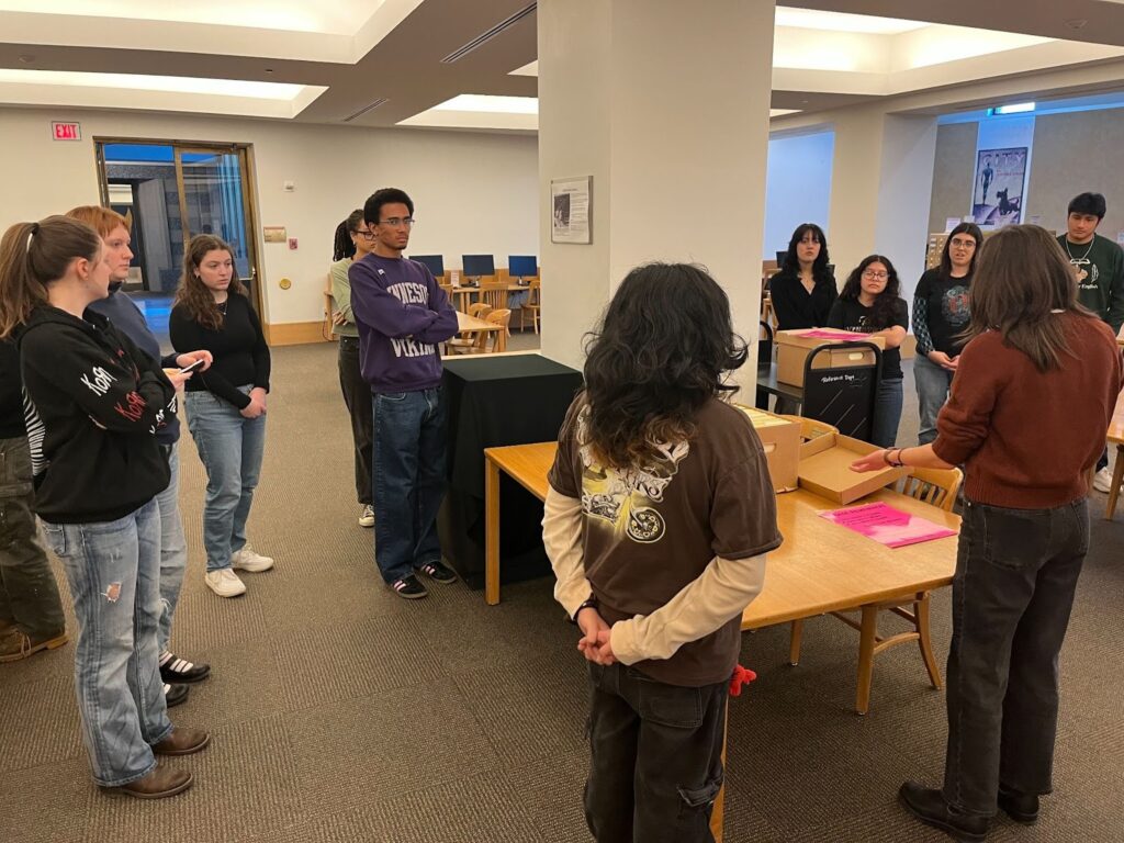 Photo of a group of students from the Invisible Cities class at the Minnesota Historical Society archives.