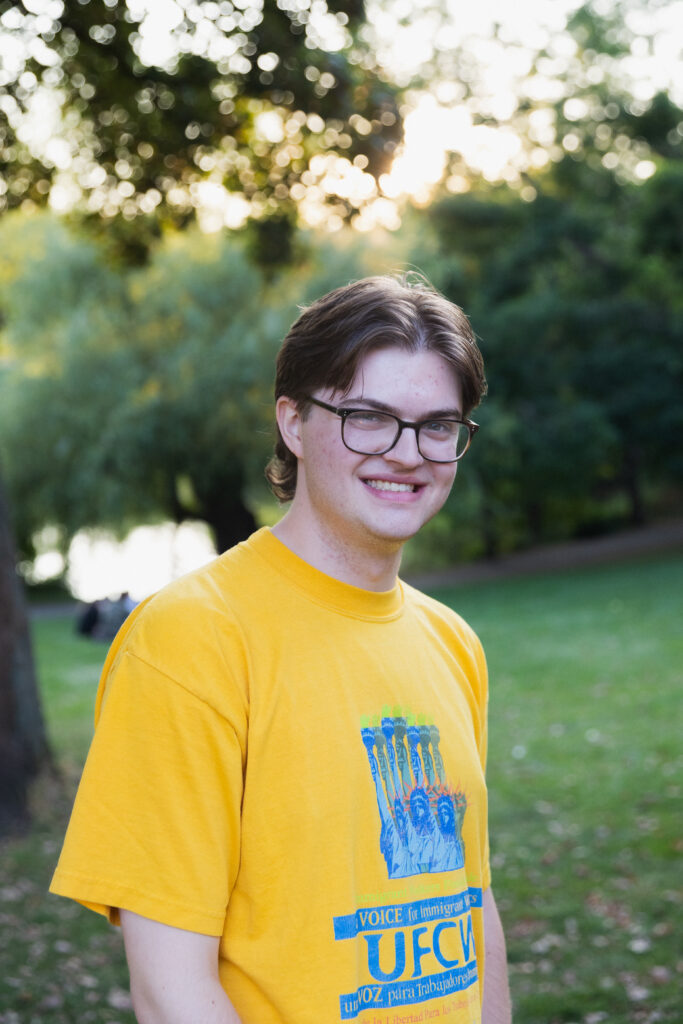 Daniel Graham's headshot in a park