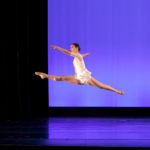 Dancer split leaping