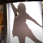 Shadow of dancer reaching