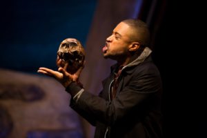Hamlet (Kory LaQuess Pullam) addresses Yorick's skull.