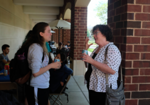 Professor English talks with student at the English Department Fall Luncheon