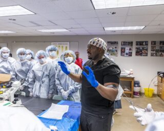 Dr. Malik Mays ’19 speaks to a room full of aspiring healthcare professionals.