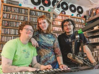 Three students at the Macalester radio station