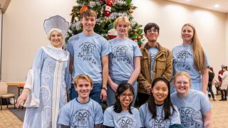 Students in Community, Identity, and Engagement course pose at the American Russian Center.